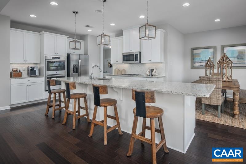 1617 Fowler Ridge Court Charlottesville, VA 22901 - Photo 6 of 23 a large kitchen with a table and chairs