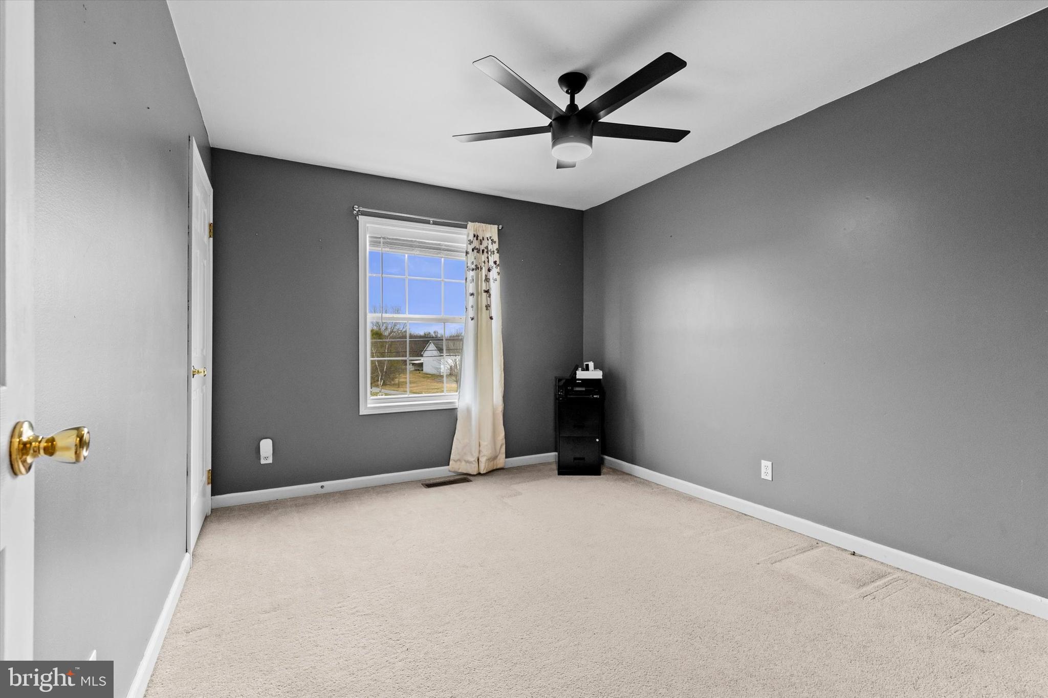 635 Newport Road Duncannon, PA 17020 - Photo 18 of 55 an empty room with a ceiling fan and window