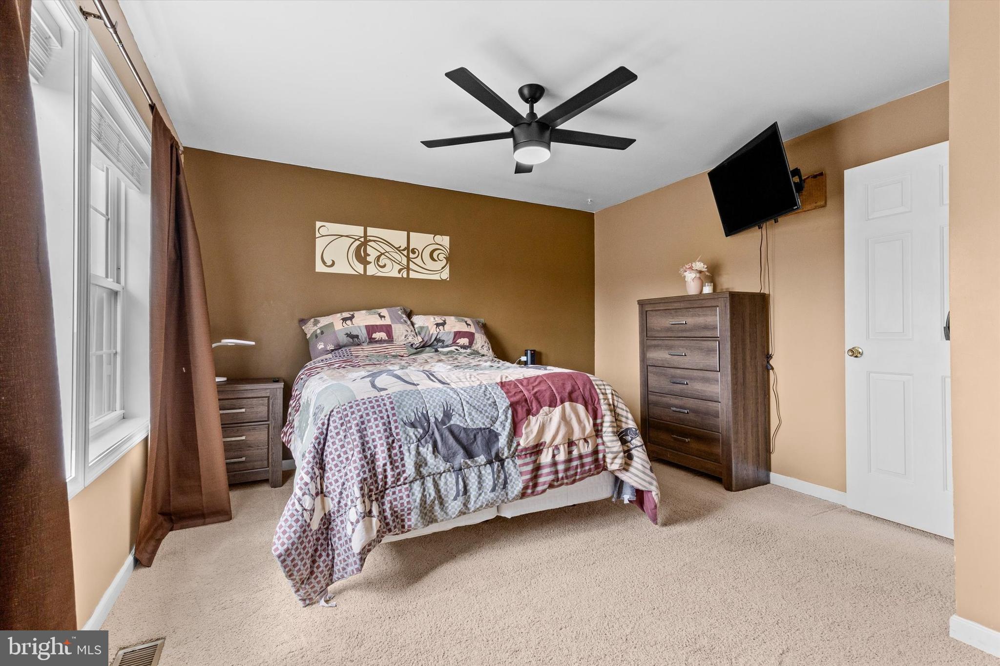 635 Newport Road Duncannon, PA 17020 - Photo 23 of 55 a bedroom with a bed and a ceiling fan