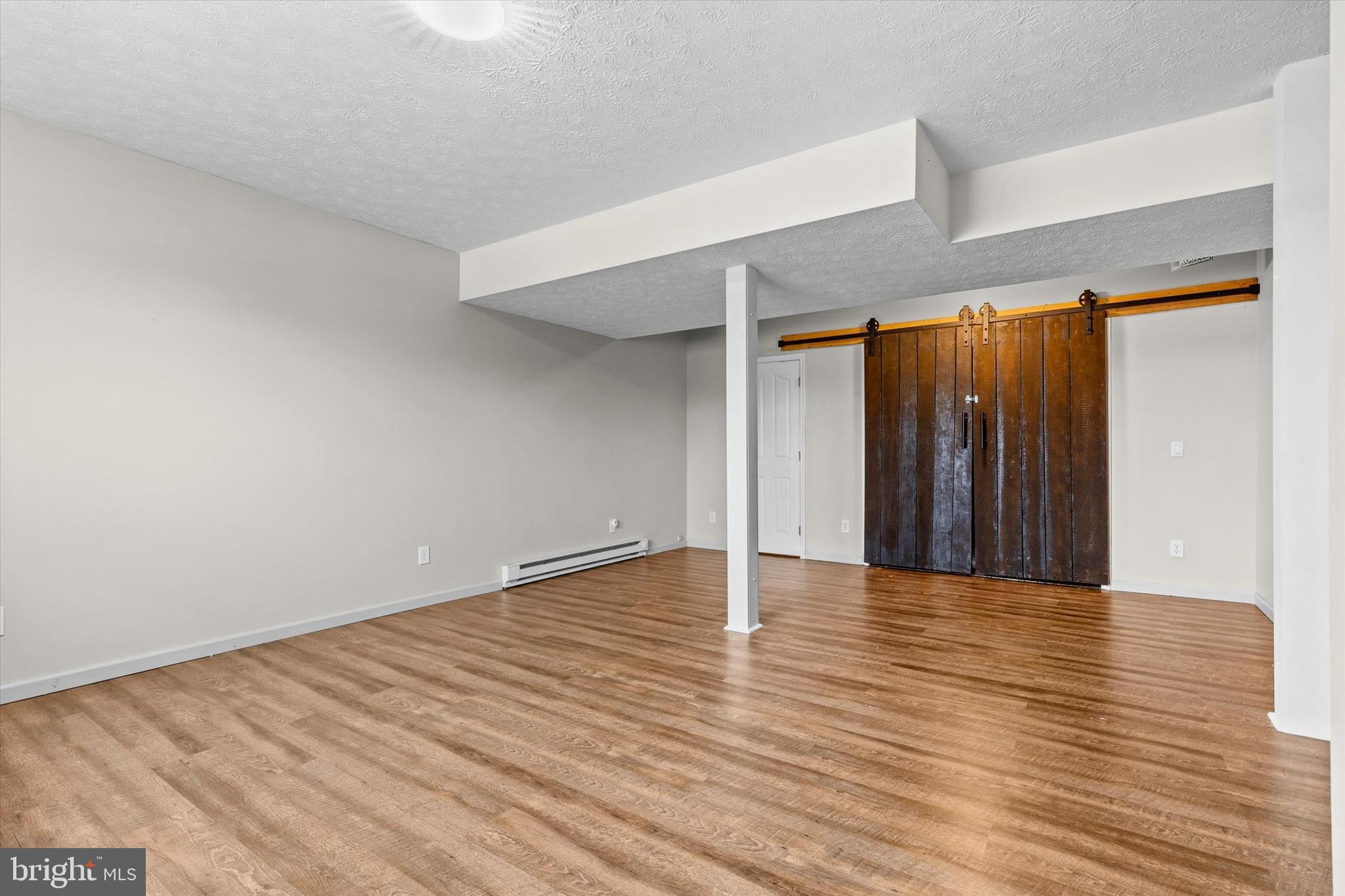 635 Newport Road Duncannon, PA 17020 - Photo 26 of 55 a view of an empty room with wooden floor