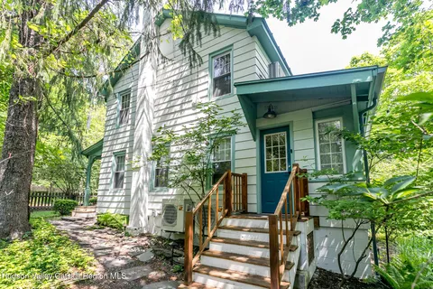 front view of a house with a small yard