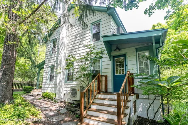 front view of a house with a small yard