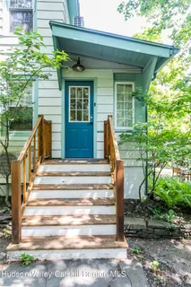 a front view of a house with a porch