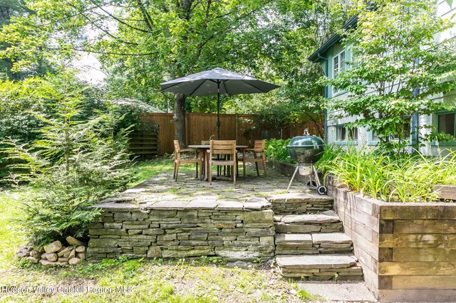 a view of a chair and table of the garden