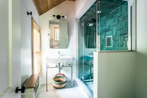 a view of a hallway to a livingroom and a floor to ceiling window