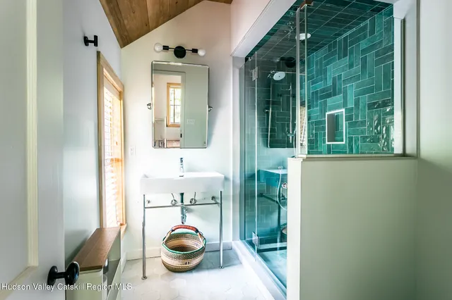 a view of a hallway to a livingroom and a floor to ceiling window
