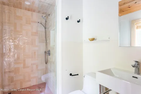 a bathroom with a sink and shower
