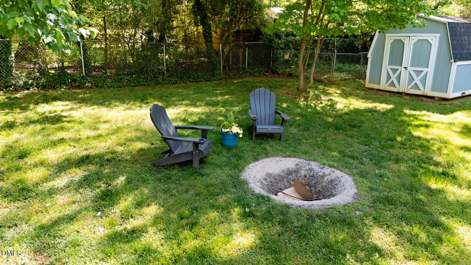 134 Longview Road Madison, NC 27025 - Photo 24 of 49 a backyard of a house with table and chairs