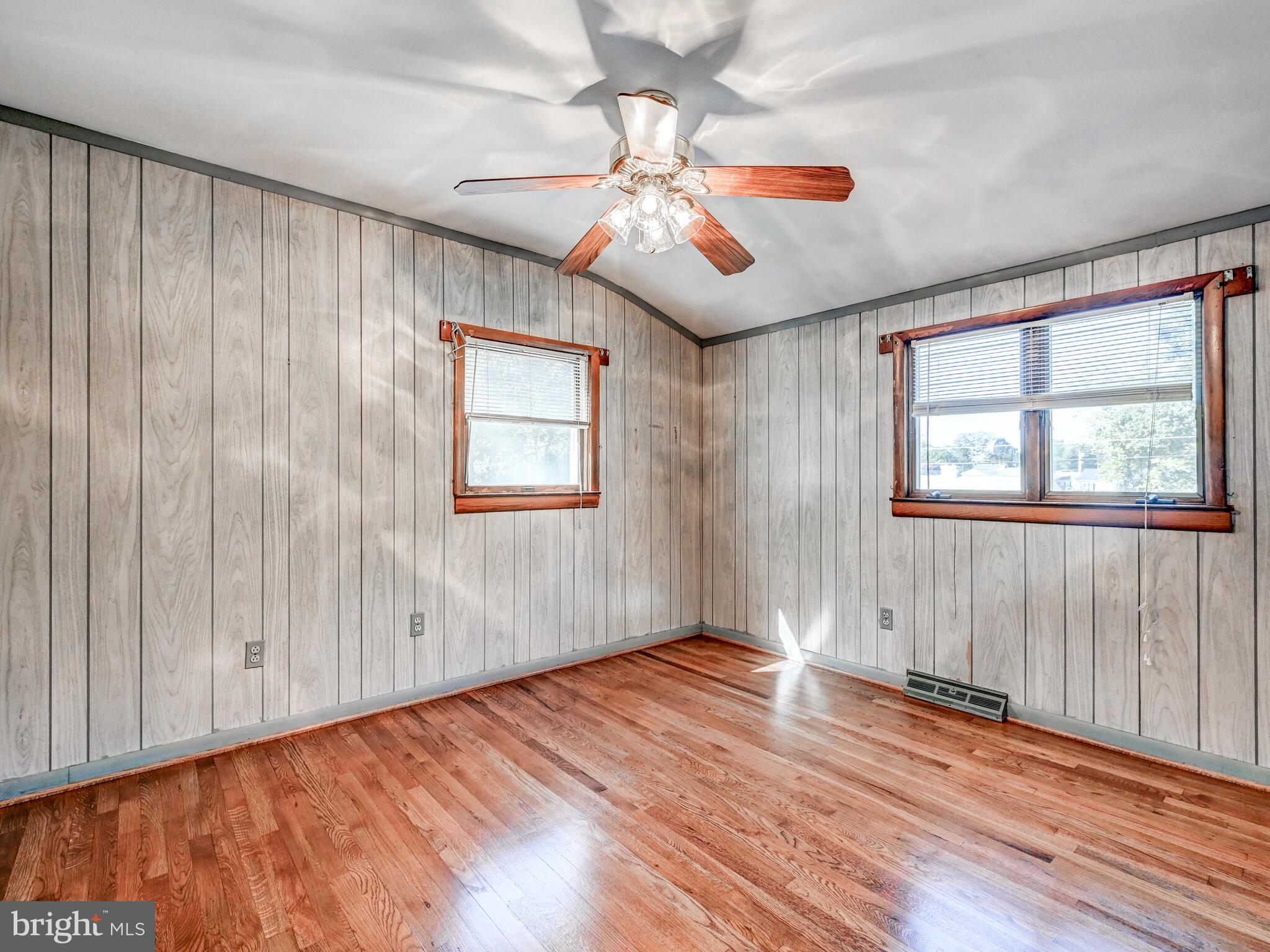 609 South Rogers Street Aberdeen, MD 21001 - Photo 12 of 45 a view of an empty room with wooden floor and a window
