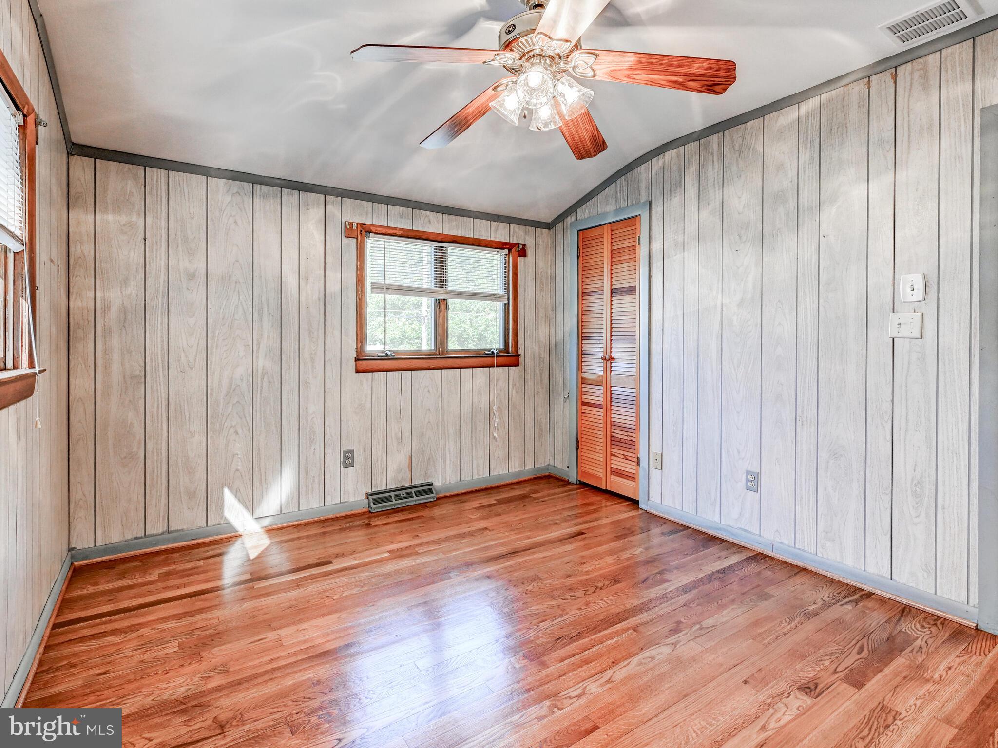 609 South Rogers Street Aberdeen, MD 21001 - Photo 14 of 45 an empty room with wooden floor fan and windows
