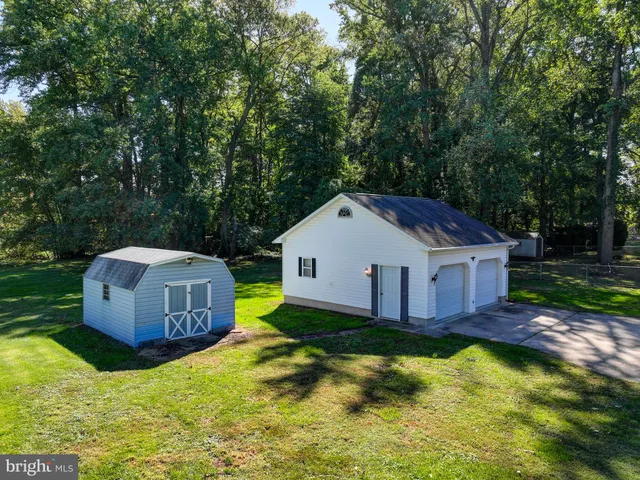 a view of a house with backyard and swimming pool