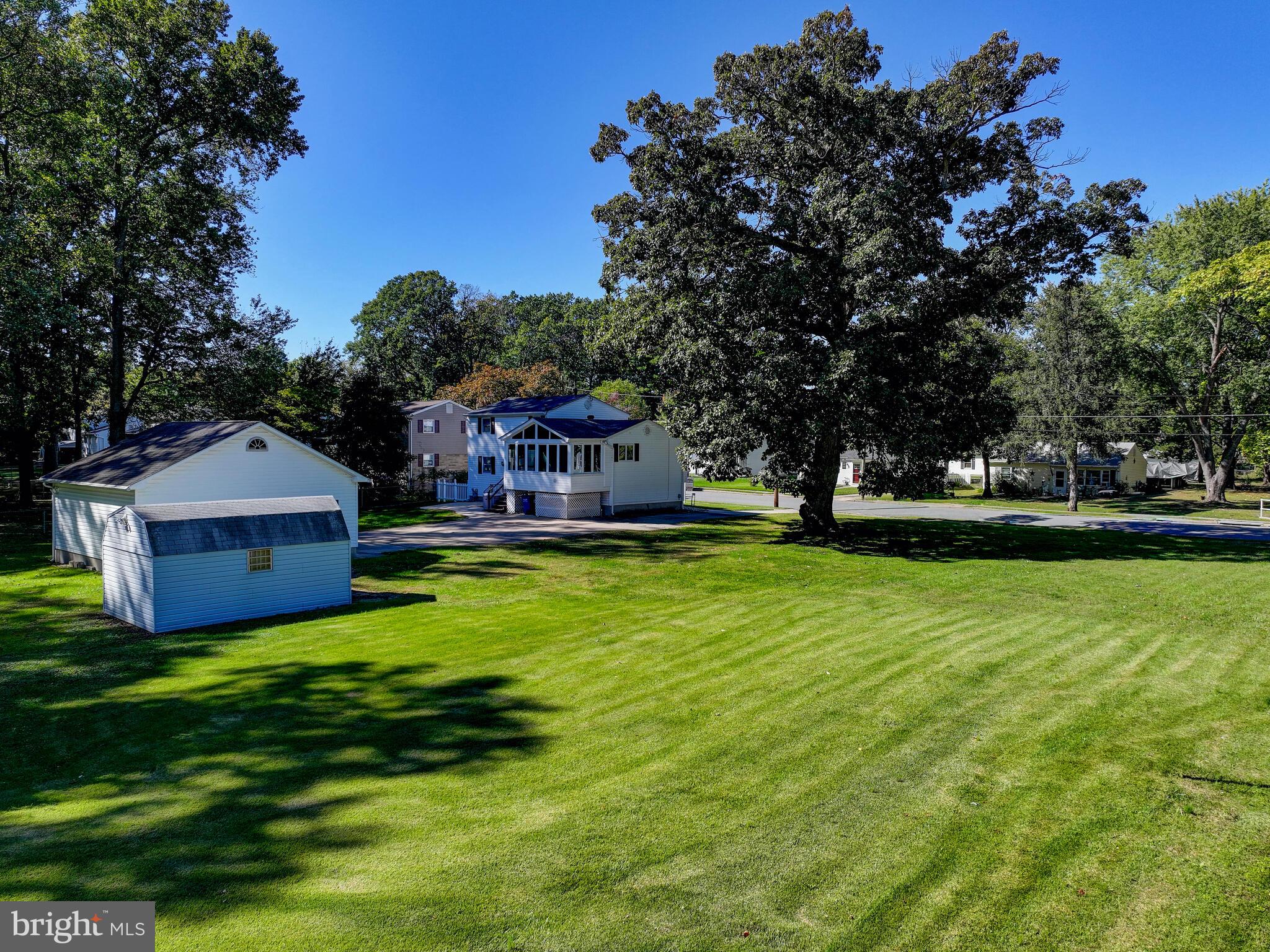 609 South Rogers Street Aberdeen, MD 21001 - Photo 30 of 45 a view of a house with a big yard potted plants and large tree