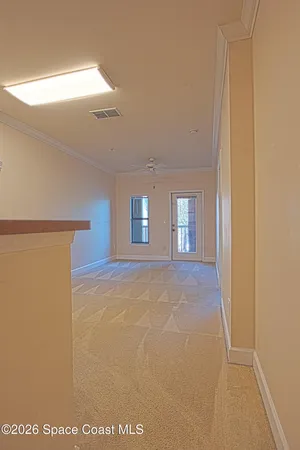 a view of an empty room with a window