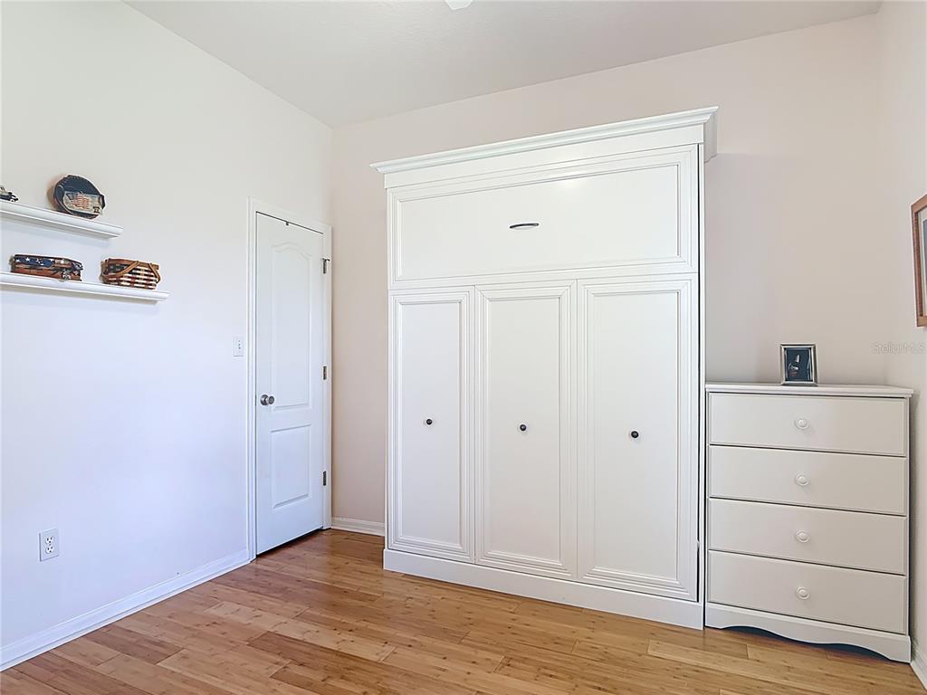 1408 3rd Street Edgewater, FL 32132 - Photo 20 of 43 a view of a closet area with hardwood floor