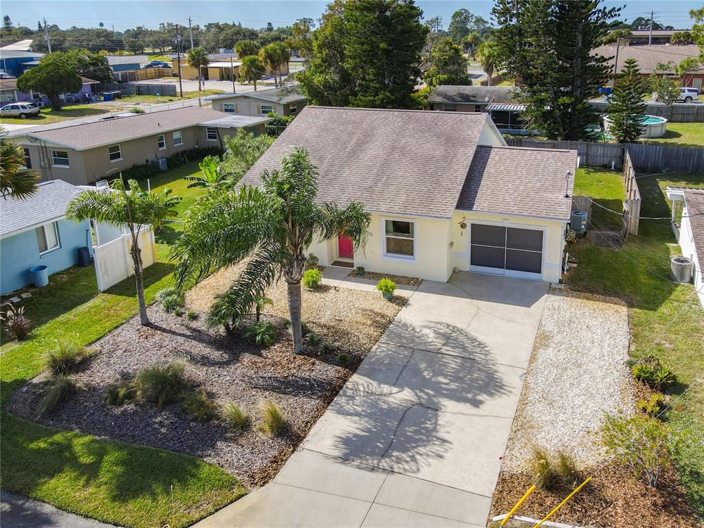 1408 3rd Street Edgewater, FL 32132 - Photo 2 of 43 a aerial view of a house with a yard and plants
