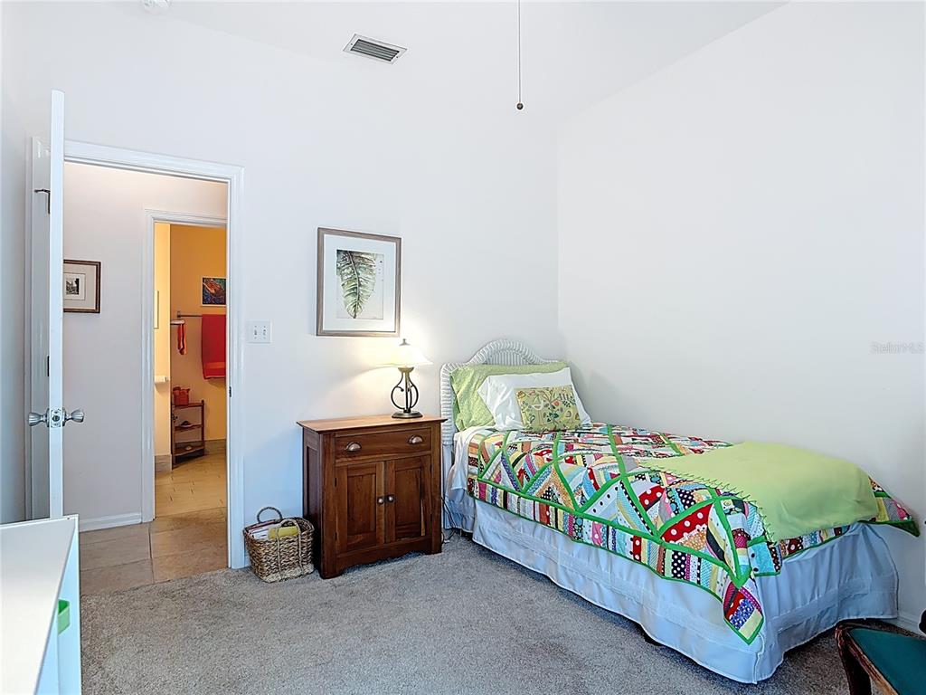 1408 3rd Street Edgewater, FL 32132 - Photo 22 of 43 a bedroom with a bed and a furniture