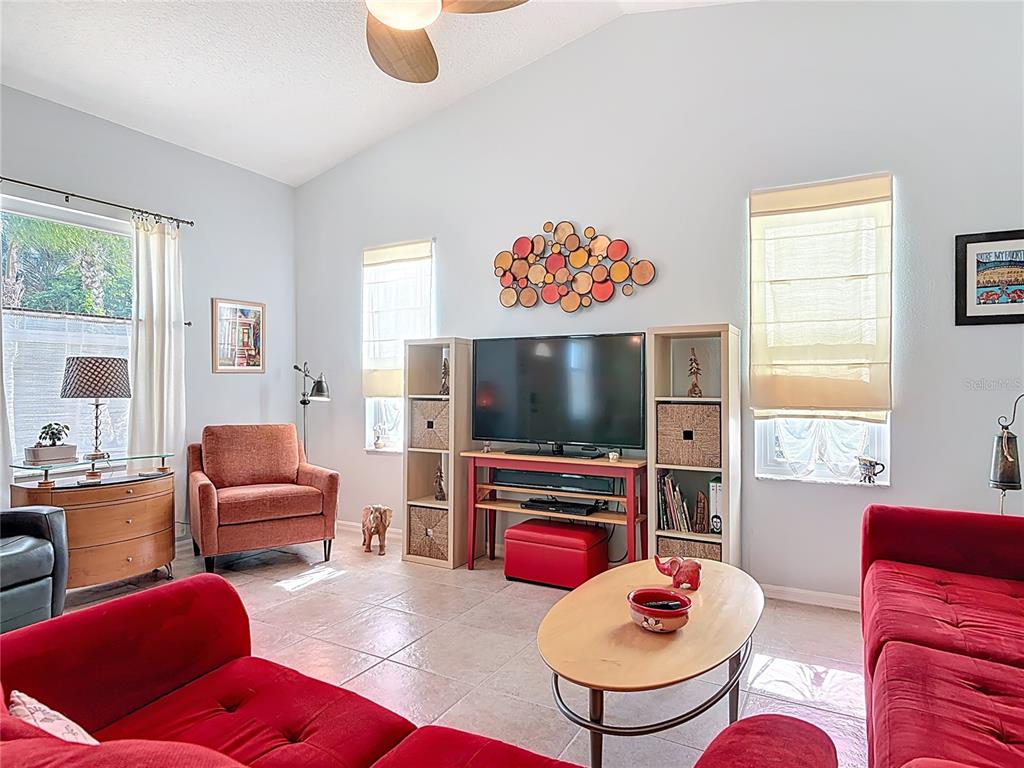 1408 3rd Street Edgewater, FL 32132 - Photo 4 of 43 a living room with furniture a flat screen tv and a window
