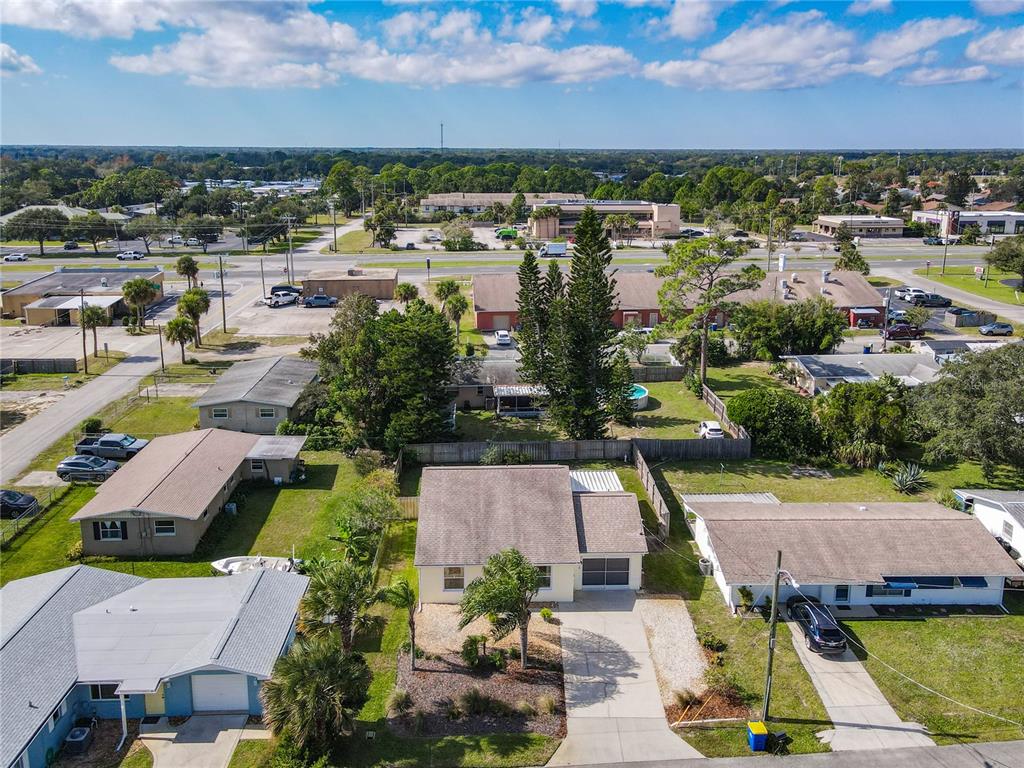 1408 3rd Street Edgewater, FL 32132 - Photo 41 of 43 an aerial view of residential houses with outdoor space and ocean view
