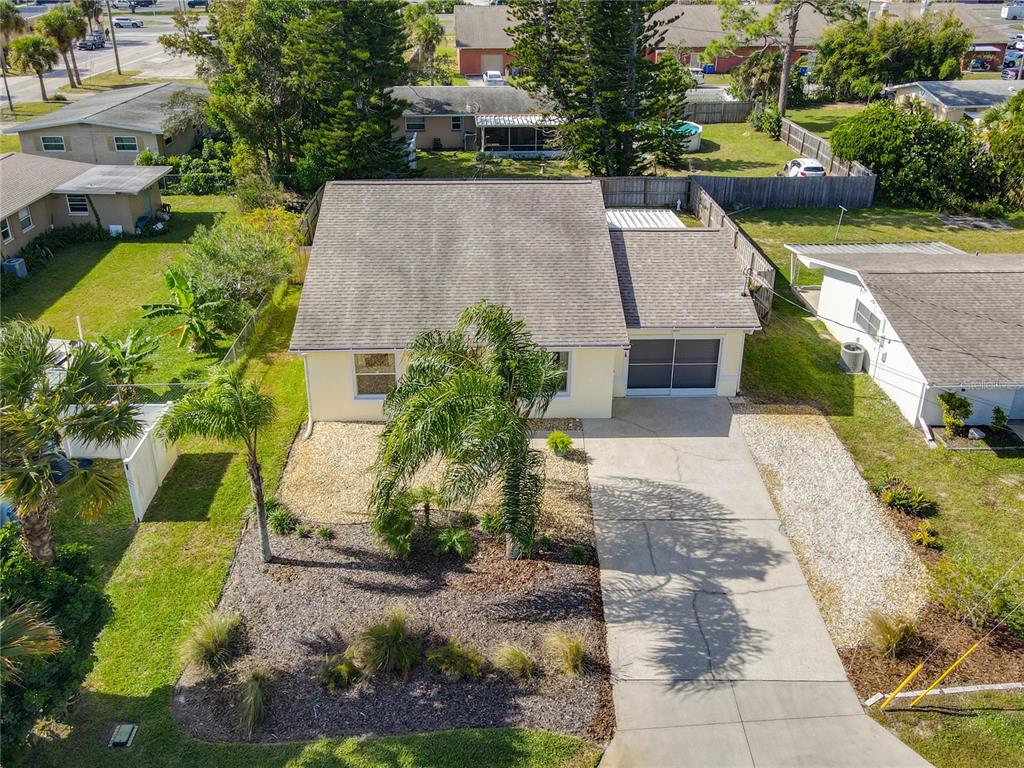 1408 3rd Street Edgewater, FL 32132 - Photo 42 of 43 an aerial view of a house with garden space and a yard
