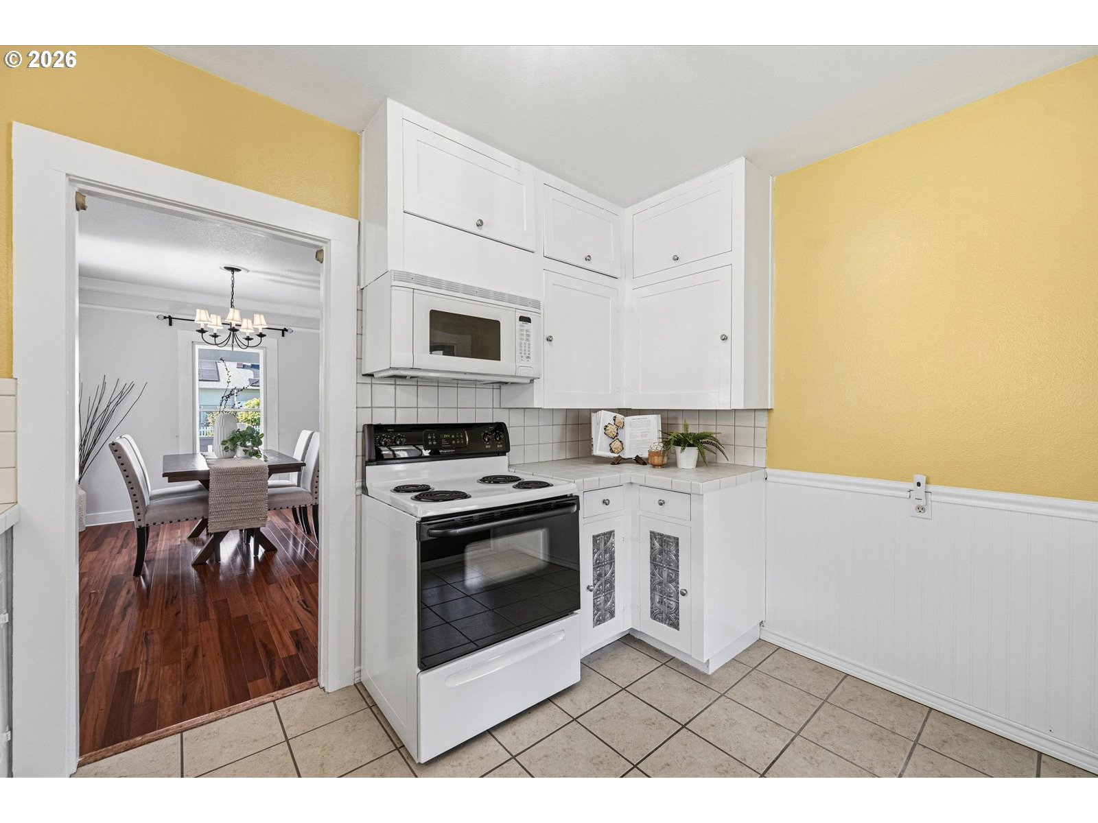 170 Northeast Main Street Estacada, OR 97023 - Photo 13 of 41 a open kitchen with a stove a sink and a microwave