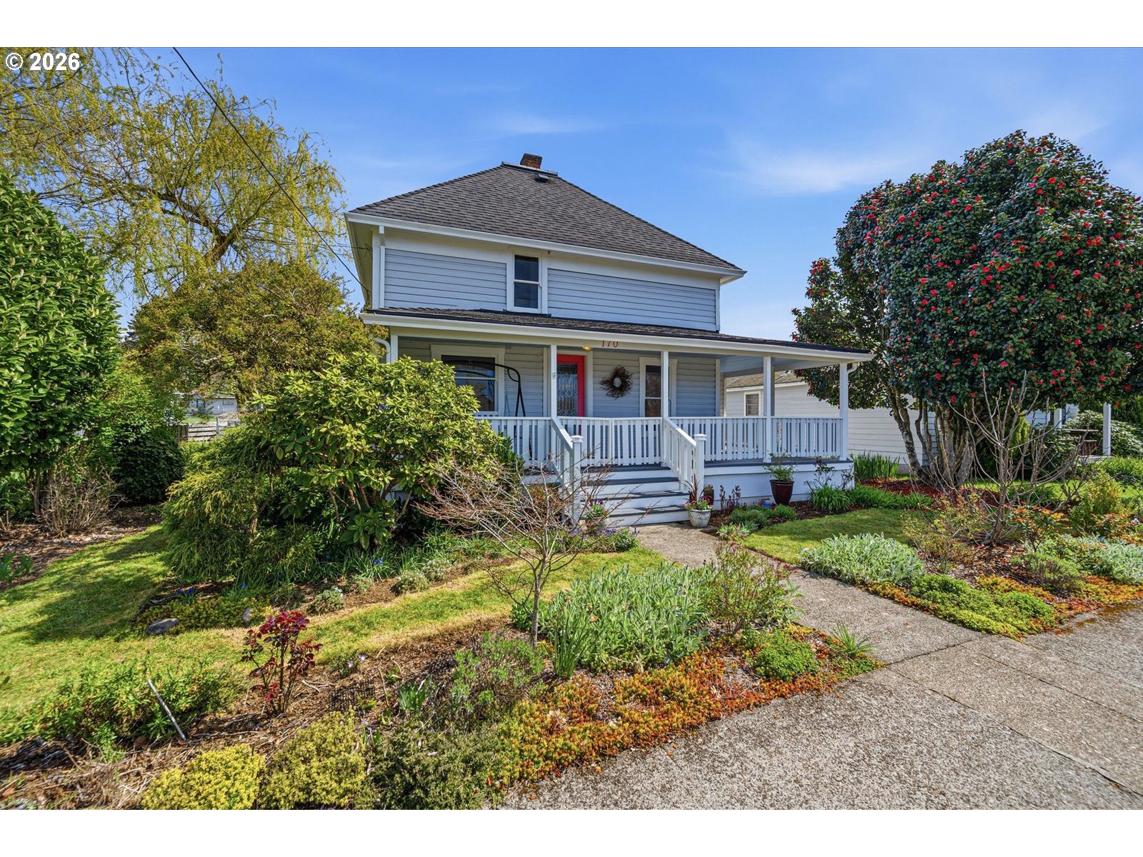 170 Northeast Main Street Estacada, OR 97023 - Photo 2 of 41 a front view of a house with garden