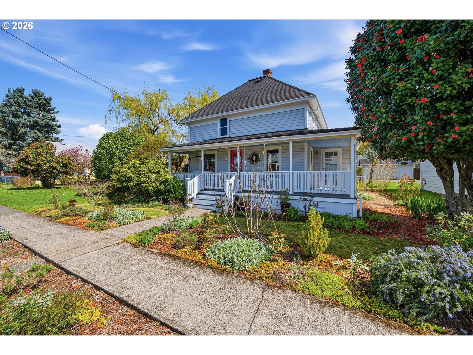 170 Northeast Main Street Estacada, OR 97023 - Photo 3 of 41 a front view of a house with a yard