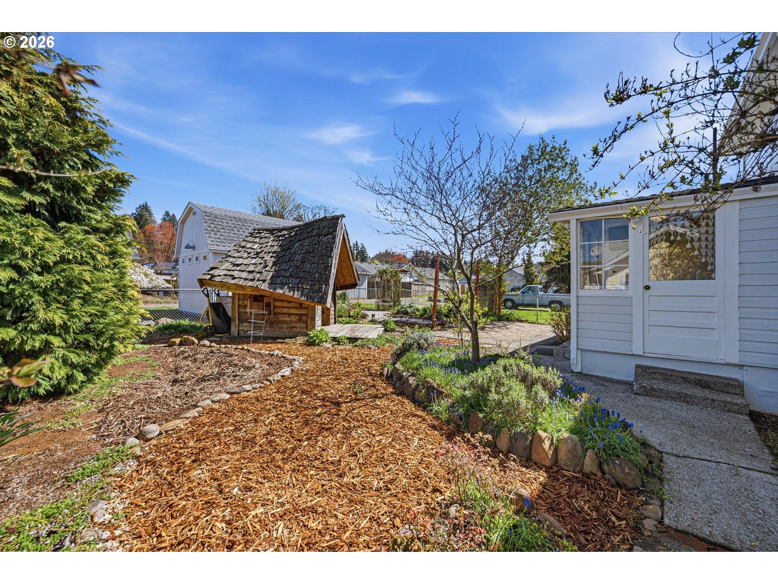 170 Northeast Main Street Estacada, OR 97023 - Photo 31 of 41 a backyard of a house with barbeque oven fire pit table and chairs