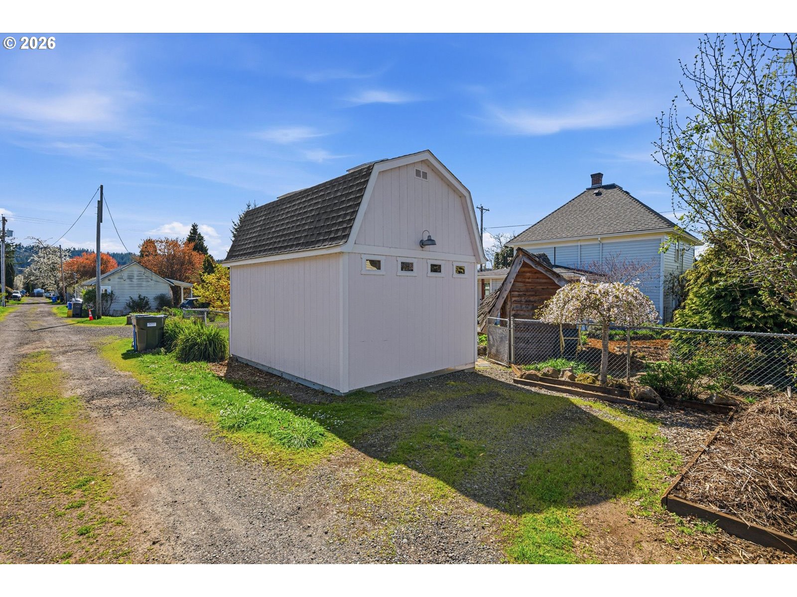 170 Northeast Main Street Estacada, OR 97023 - Photo 35 of 41 a front view of a house with a garden and yard