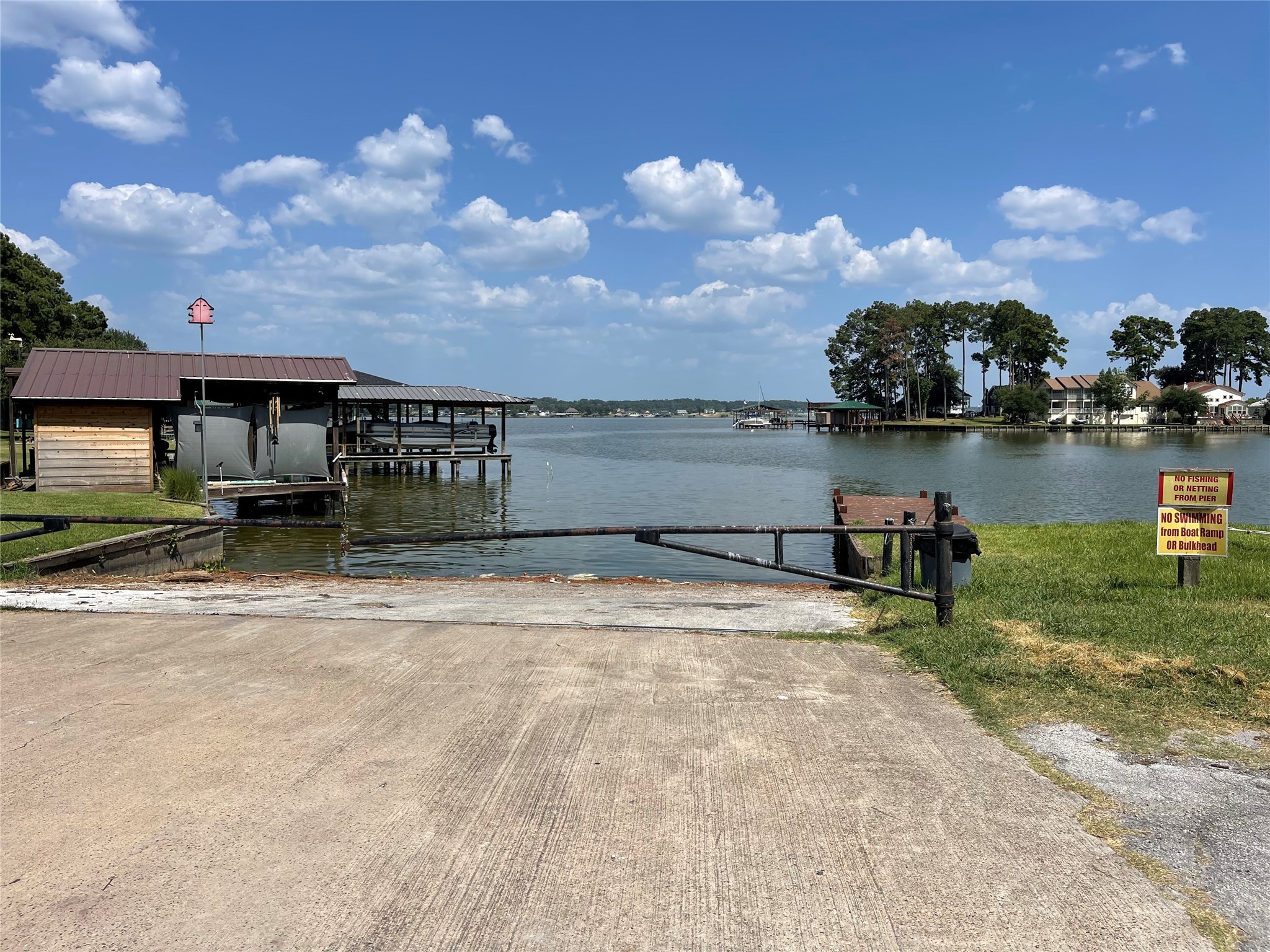 Tbddd Valleyview Drive Onalaska, TX 77360 - Photo 3 of 3 a view of a lake with a house in the background