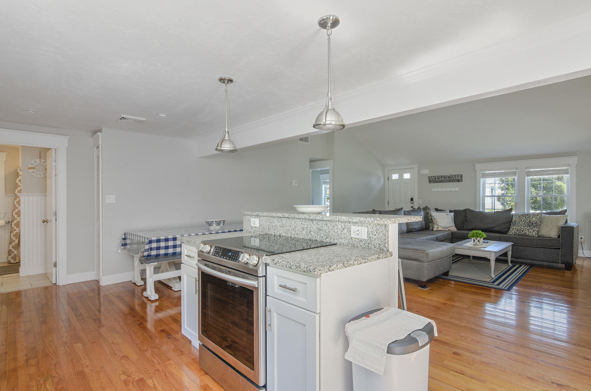 31 Glendon Road Dennis Port, MA 02639 - Photo 9 of 21 a open kitchen with stainless steel appliances granite countertop a stove and wooden floor