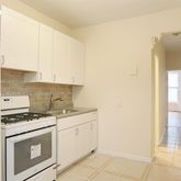 a kitchen with cabinets and appliances