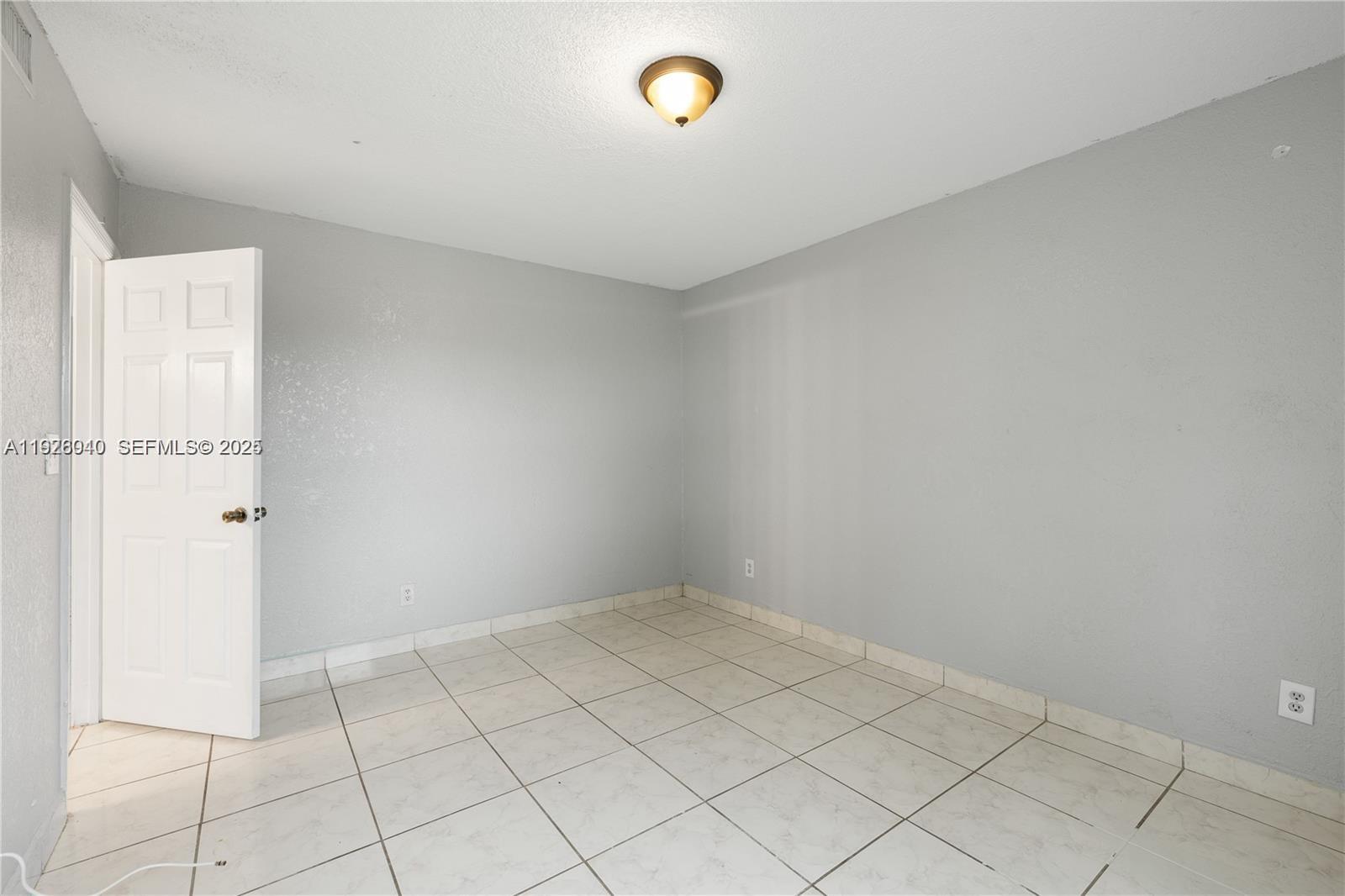 1276 Southwest 113th Terrace, Unit 101 Pembroke Pines, FL 33025 - Photo 14 of 18 a view of an empty room