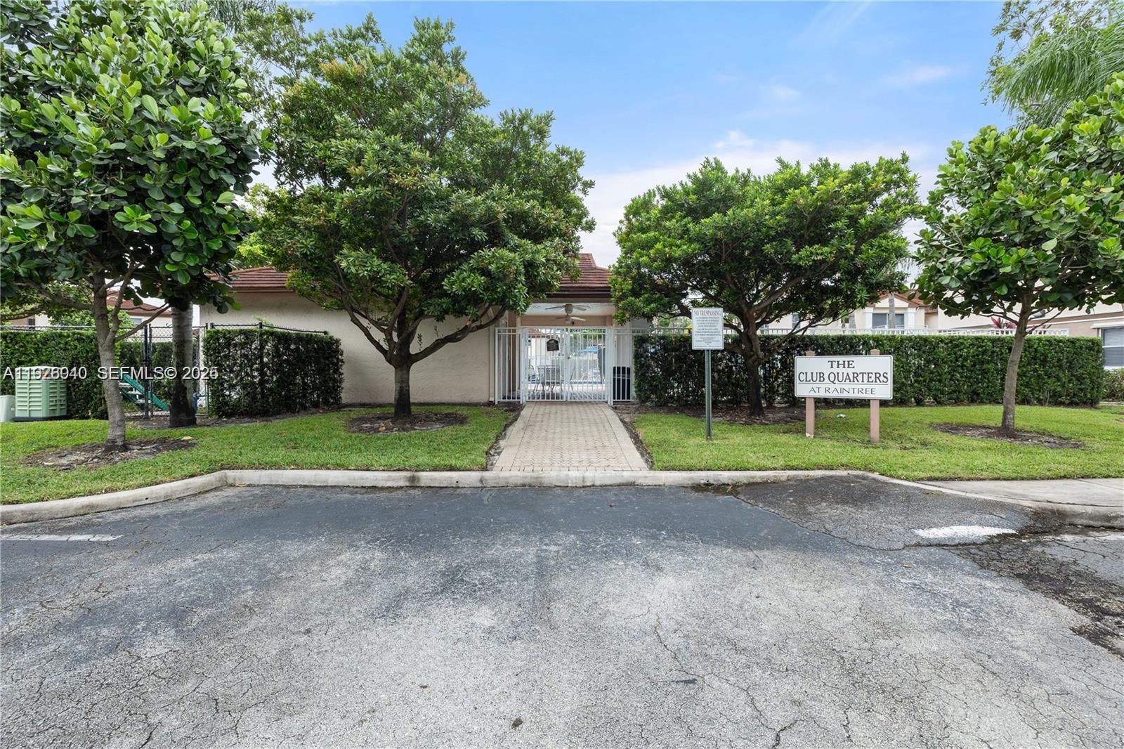 1276 Southwest 113th Terrace, Unit 101 Pembroke Pines, FL 33025 - Photo 17 of 18 a view of a house with a yard