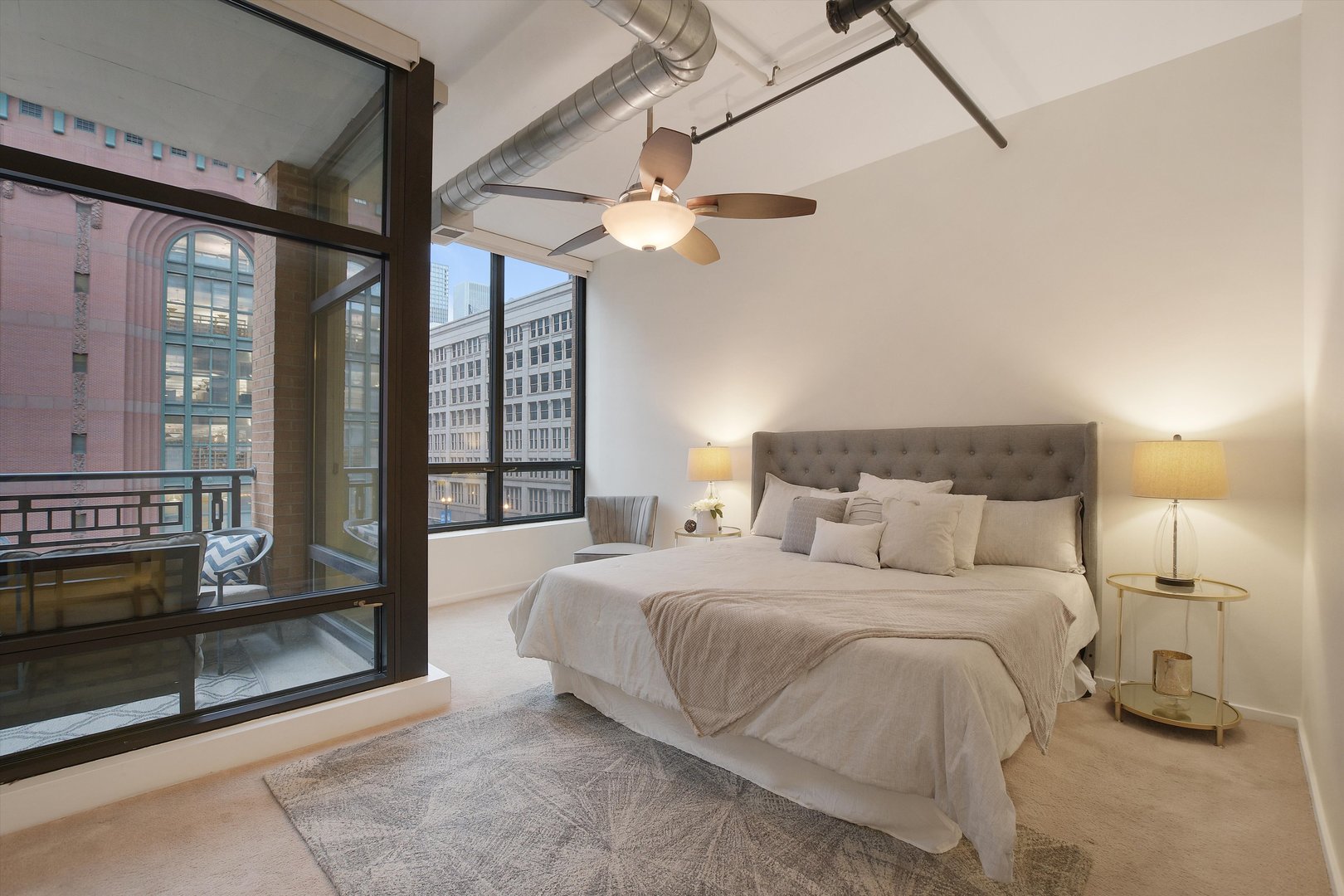 520 South State Street, Unit 510 Chicago, IL 60605 - Photo 15 of 34 a bedroom with a large bed and a chandelier