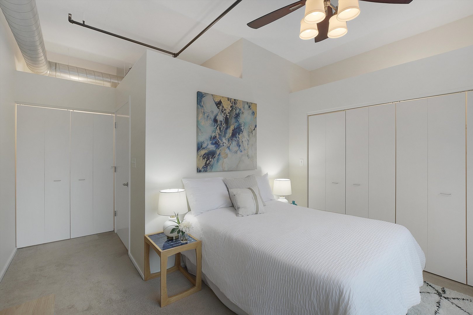 520 South State Street, Unit 510 Chicago, IL 60605 - Photo 21 of 34 a bedroom with a bed and a painting on the wall