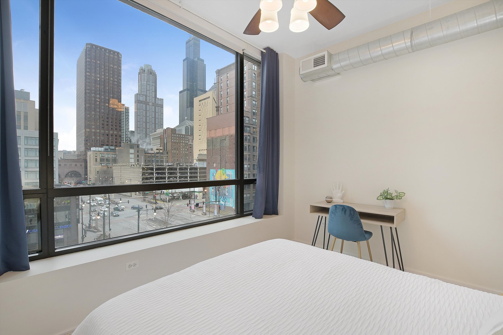 520 South State Street, Unit 510 Chicago, IL 60605 - Photo 22 of 34 a bedroom with a large bed and a window