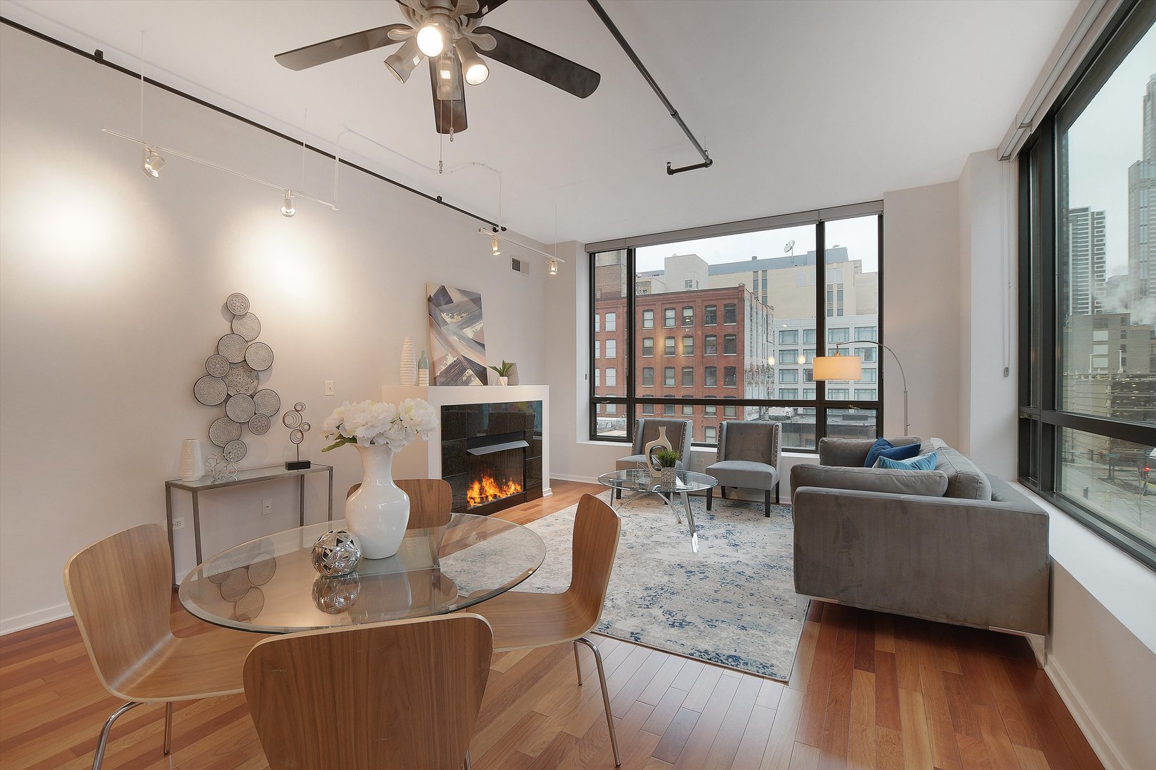 520 South State Street, Unit 510 Chicago, IL 60605 - Photo 3 of 34 a living room with furniture and a fireplace
