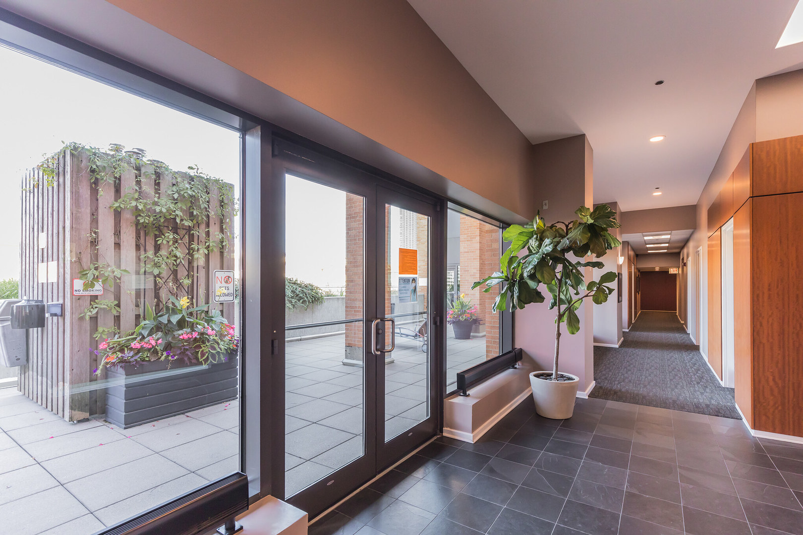 520 South State Street, Unit 510 Chicago, IL 60605 - Photo 34 of 34 a hallway with a potted plant in front of it