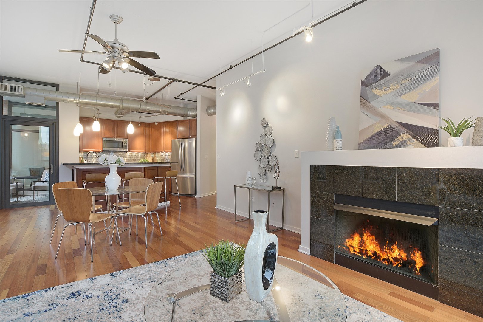 520 South State Street, Unit 510 Chicago, IL 60605 - Photo 4 of 34 a living room with furniture and a fireplace
