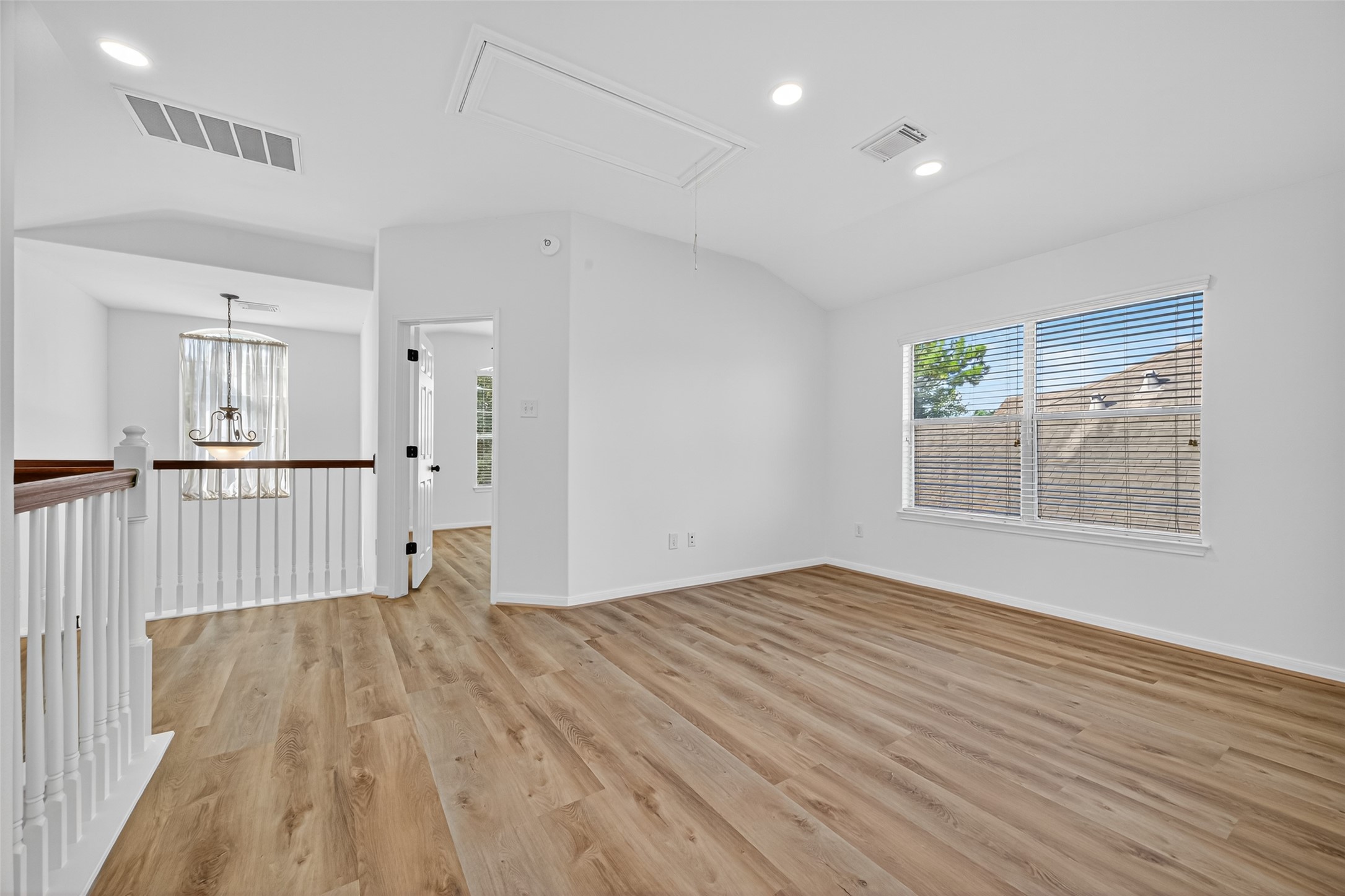 17422 Bending Post Drive Houston, TX 77095 - Photo 36 of 48 a view of an empty room with wooden floor and a window