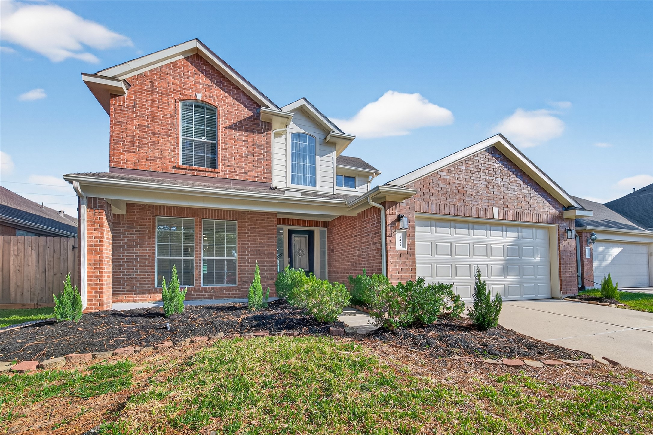 17422 Bending Post Drive Houston, TX 77095 - Photo 4 of 48 a front view of a house with garden