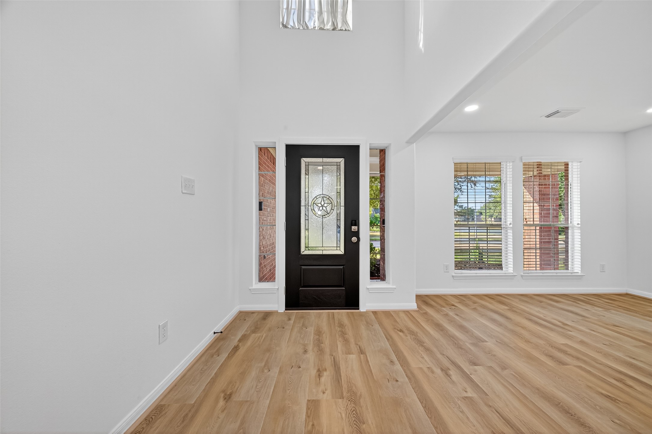 17422 Bending Post Drive Houston, TX 77095 - Photo 7 of 48 a view of an empty room with wooden floor and a window