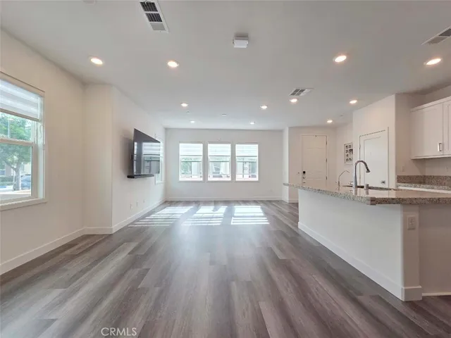 a view of kitchen and wooden floor