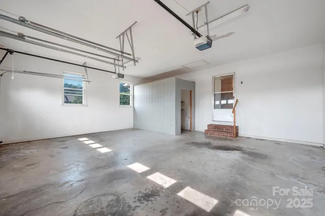 a view of a livingroom with a ceiling fan and window