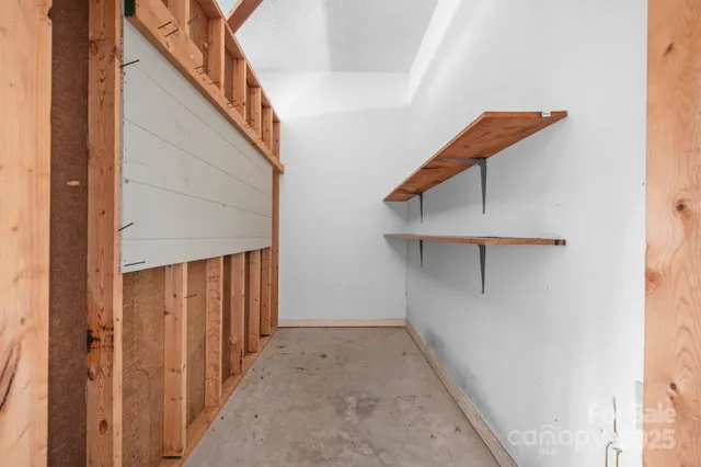 a view of a hallway with staircase