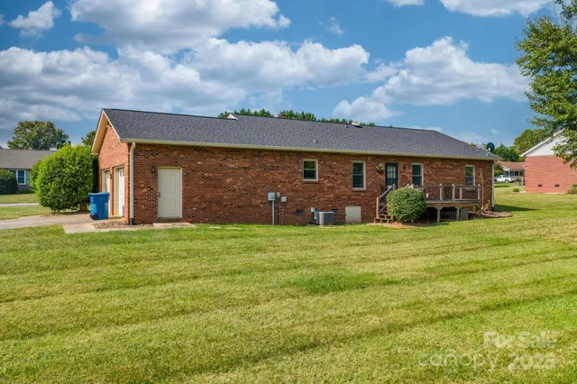 a front view of house with yard outdoor seating and barbeque oven