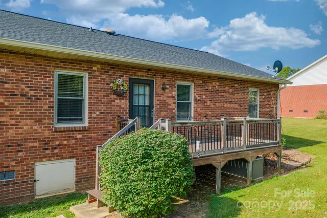 a view of a house with a window and garden