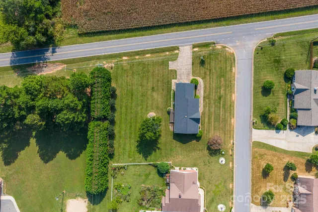 an aerial view of residential houses with outdoor space