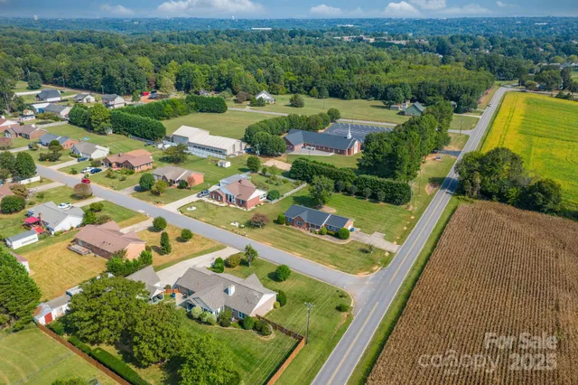 an aerial view of multiple house with a yard