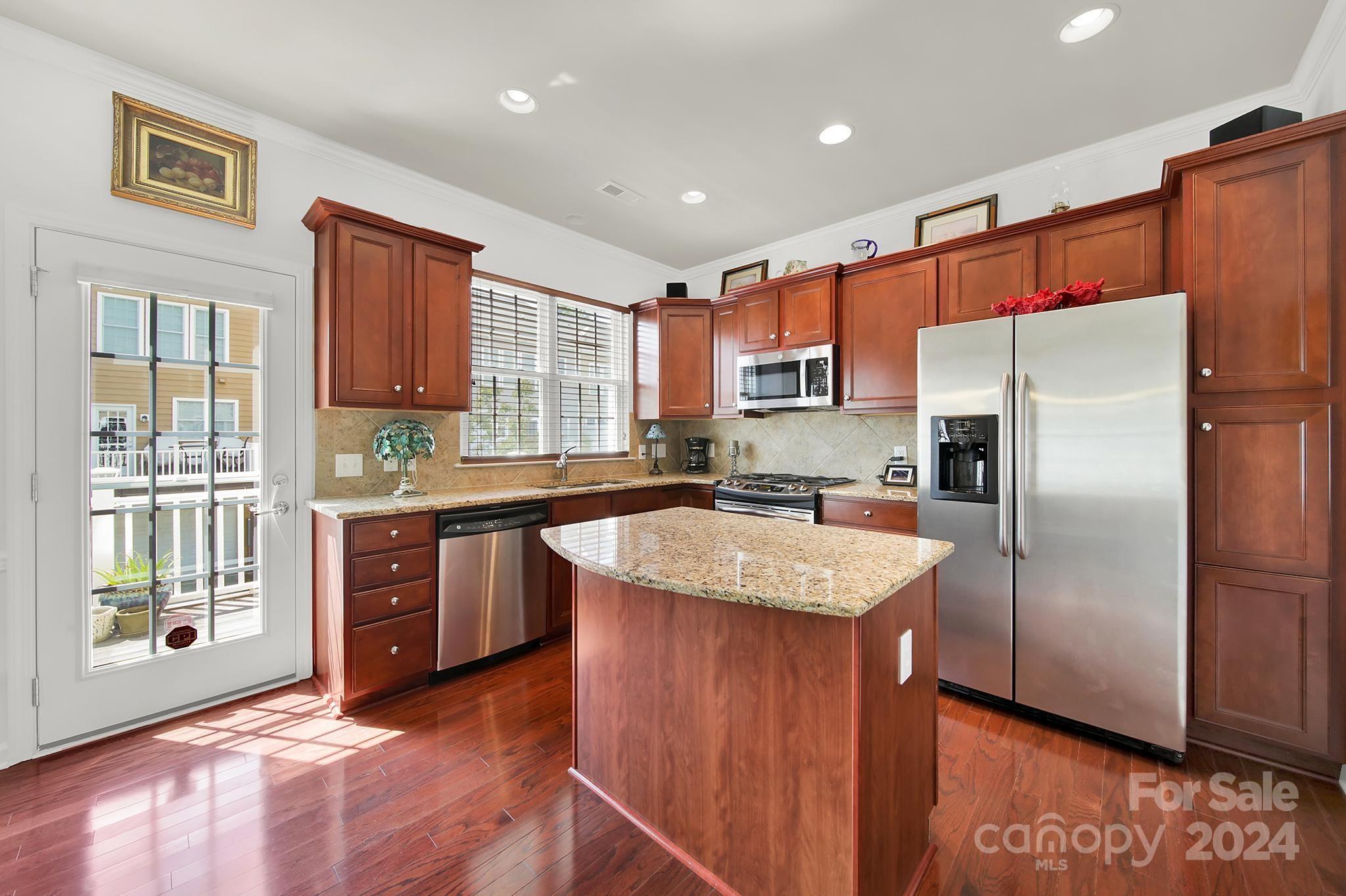 1074 Drayton Court Fort Mill, SC 29708 - Photo 11 of 37 a kitchen with stainless steel appliances granite countertop a refrigerator a sink a stove a microwave and island
